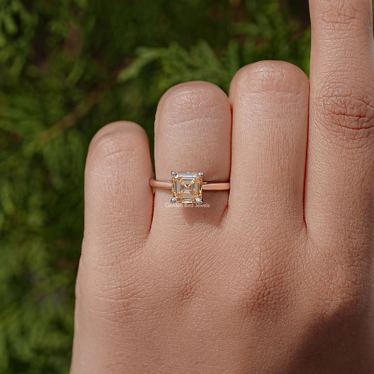 Sterling silver Asscher-cut moissanite solitaire ring, square stone centered on the band.