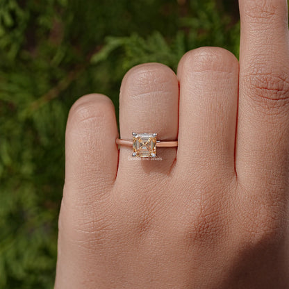 Sterling silver Asscher-cut moissanite solitaire ring, square stone centered on the band.
