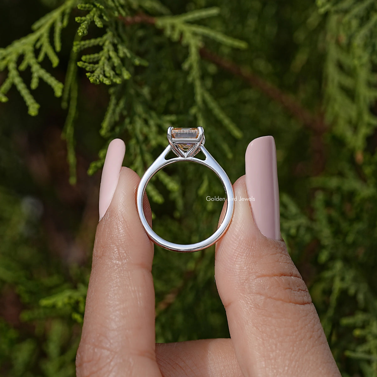 Sterling silver solitaire ring with Asscher-cut moissanite, shown from the front.