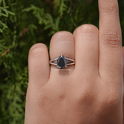 925 sterling silver split-shank ring with pear-cut black stone, worn on hand