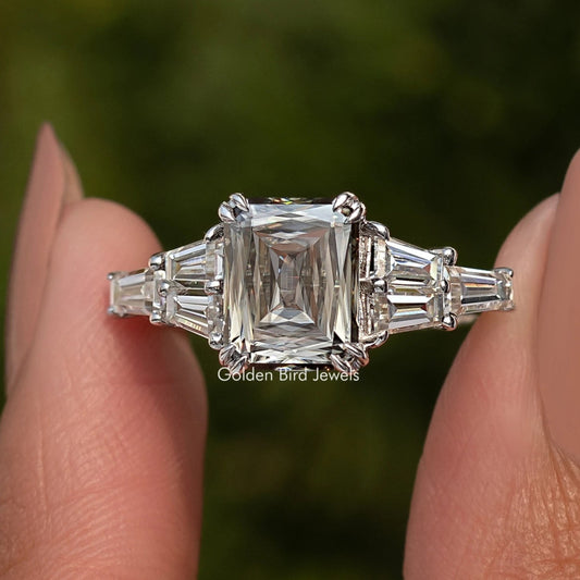 Sterling silver ring with rectangular step-cut center moissanite and baguette side stones