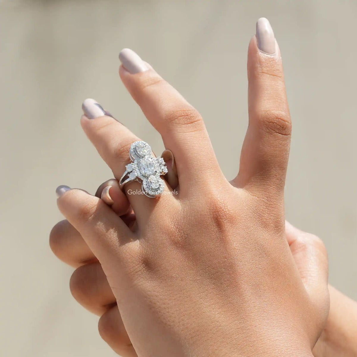 View of Old Mine Cushion And Pear Cut Moissanite Engagement Ring In Finger