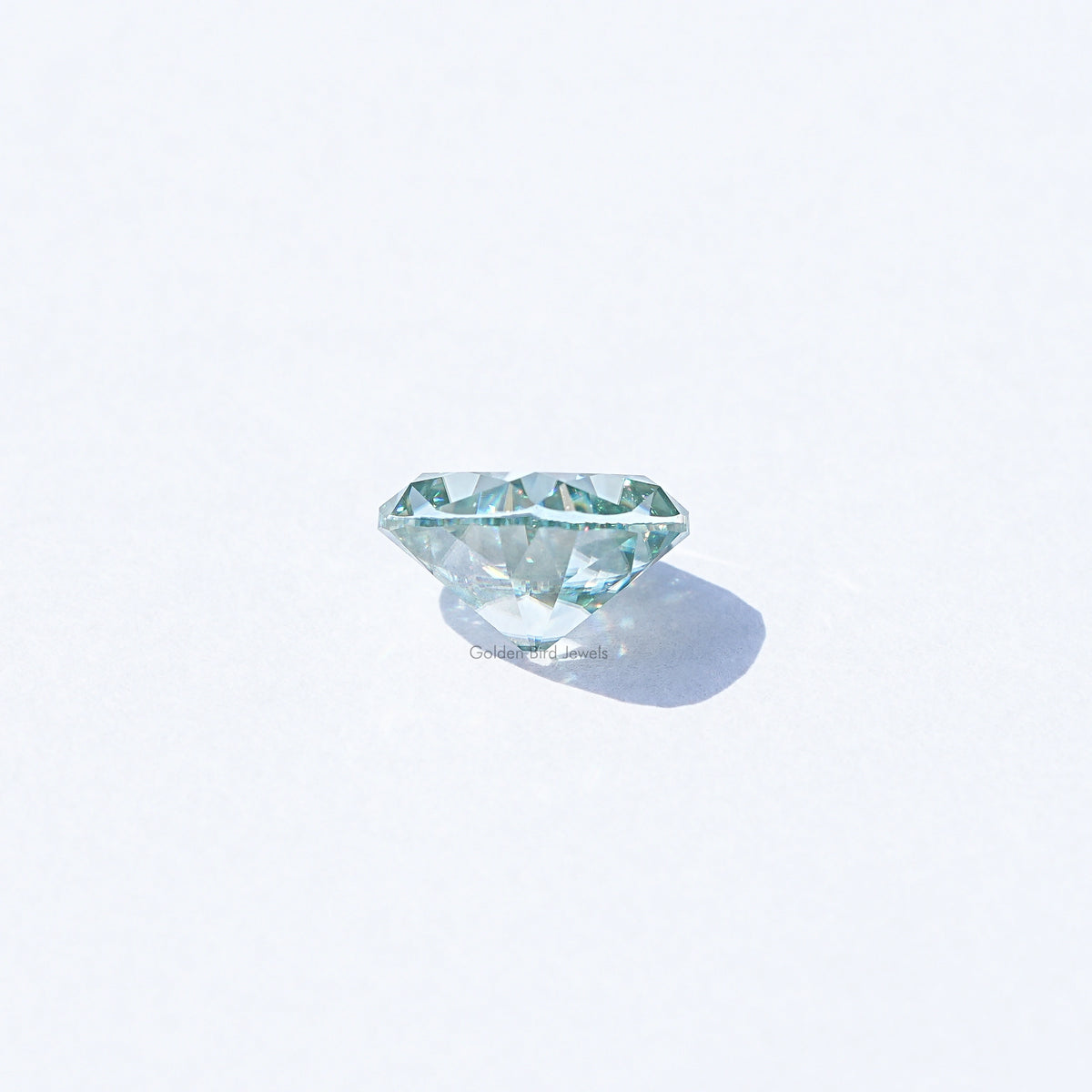 Light blue moissanite gemstone, cushion old mine cut, loose side view