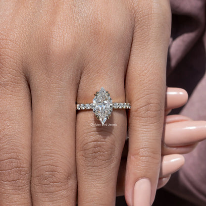 Silver moissanite solitaire ring with marquise-cut center and prong-set pave band