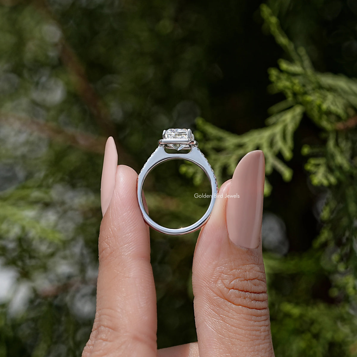 Reverse view: sterling silver ring showing open basket for cushion-cut moissanite