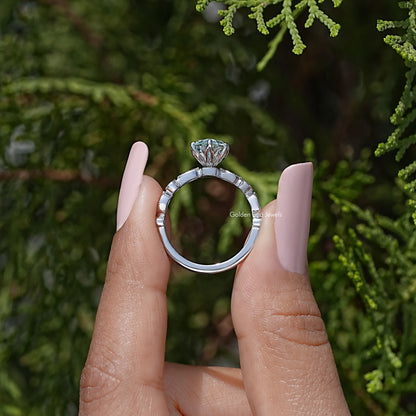 Sterling silver engagement ring side view with blue marquise center and halo detail
