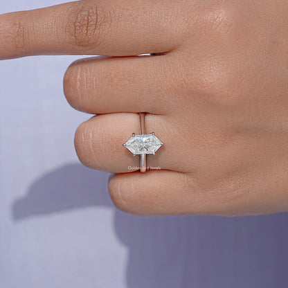 Marquise moissanite solitaire ring with small prongs, close-up on finger