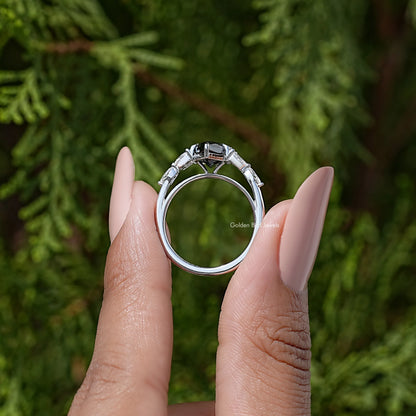 Silver ring back view with prongs around marquise black center stone