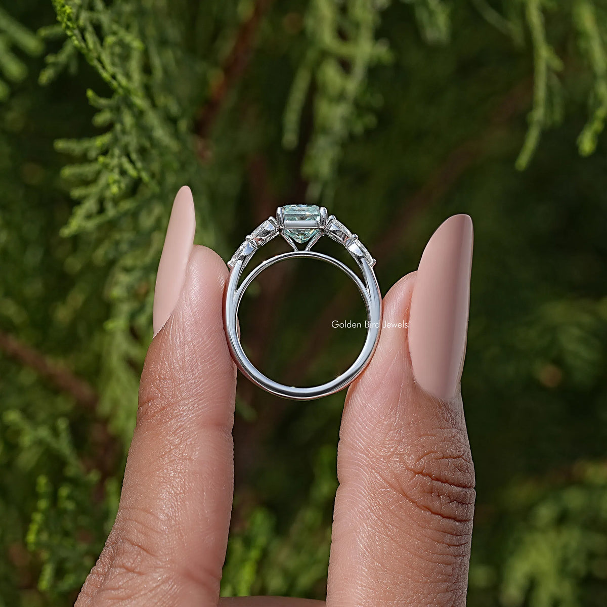 Sterling silver ring with cushion-cut center stone and halo detail