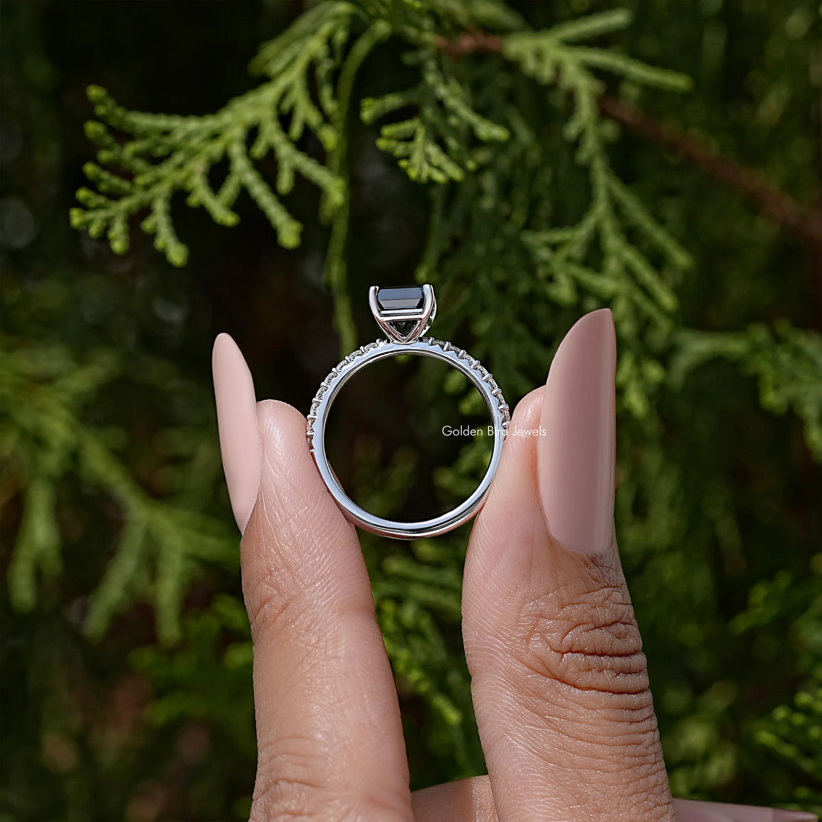 Sterling silver ring with pavé accents and raised emerald-cut mount