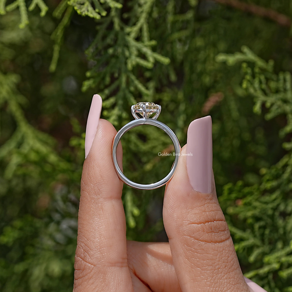 Oval moissanite split-shank engagement ring in 925 sterling silver, profile view