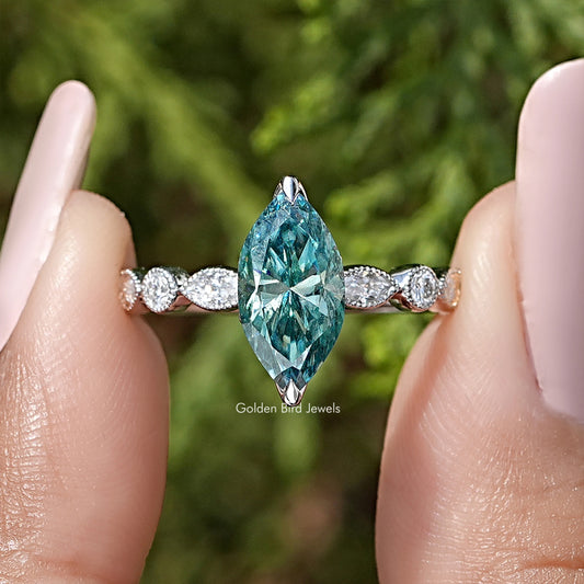 925 sterling silver marquise moissanite ring with teal center and round side stones