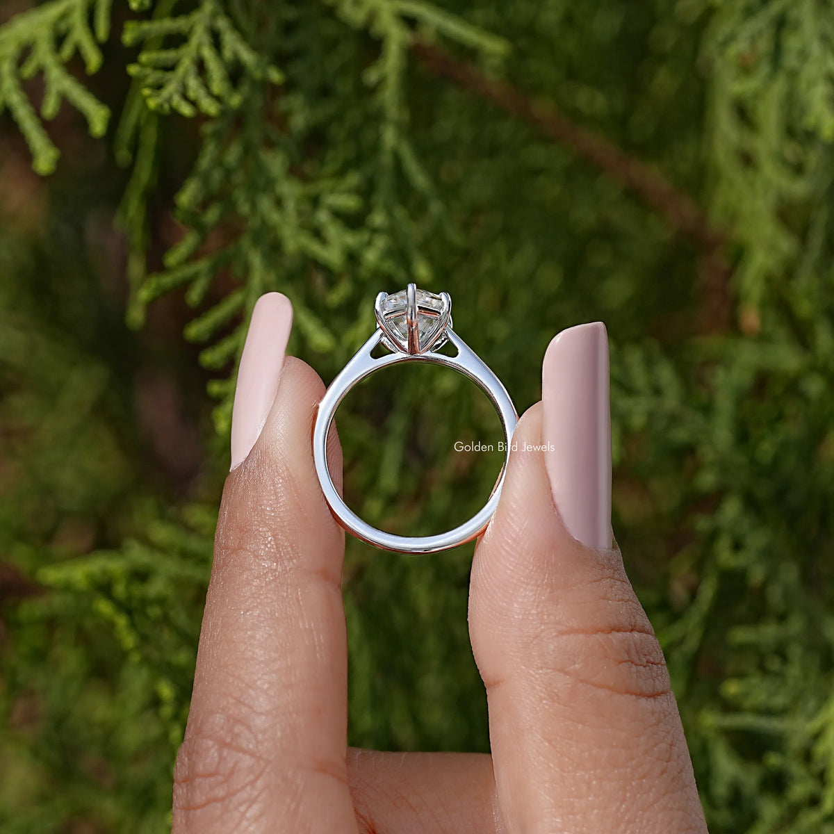 Sterling silver marquise moissanite solitaire ring with metal prong halo, viewed from back