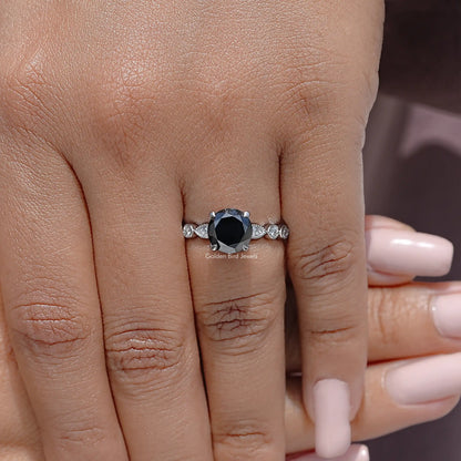 Round-cut moissanite engagement ring with pavé band and halo setting on a hand