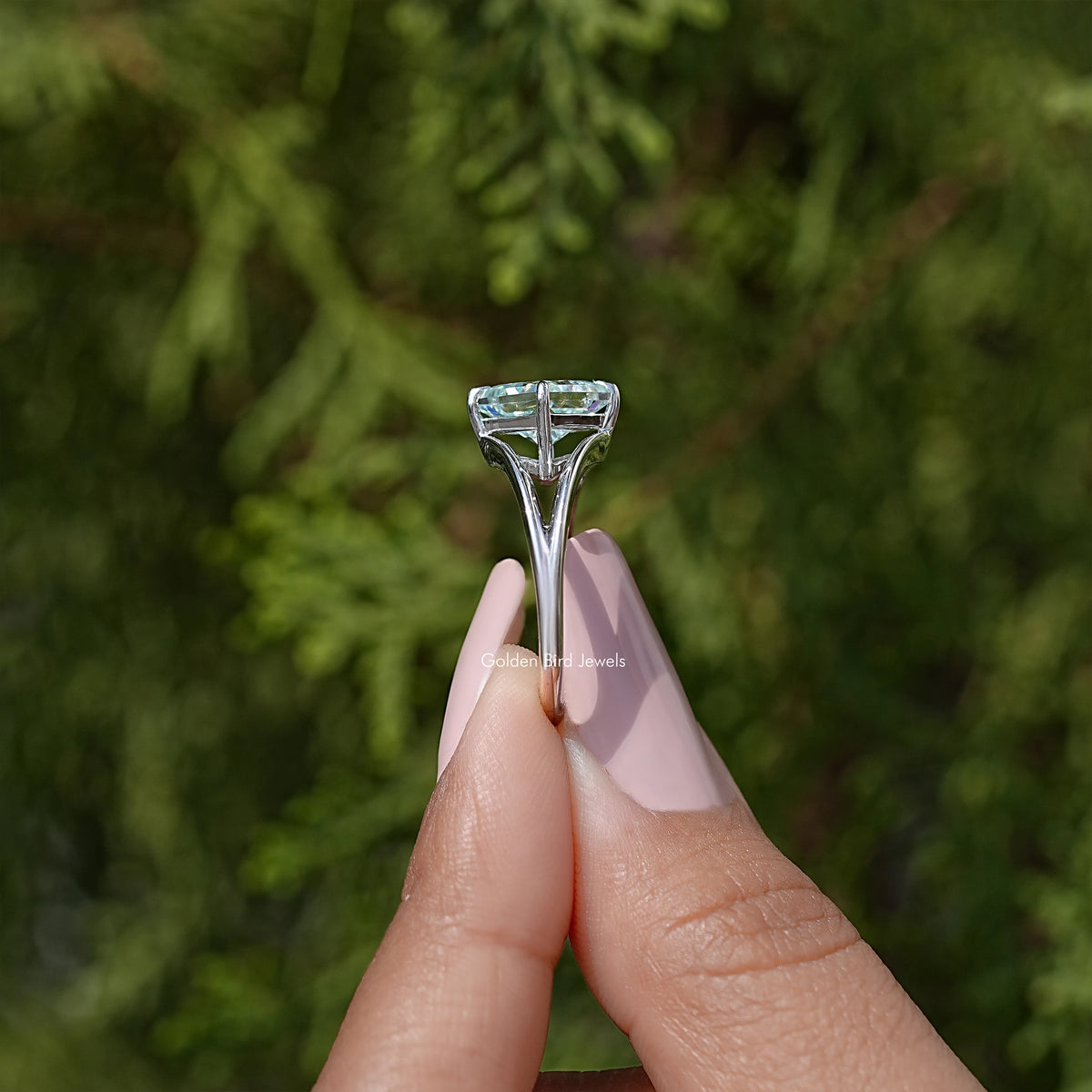 Sterling silver split-shank moissanite ring, angled view of raised princess-cut setting