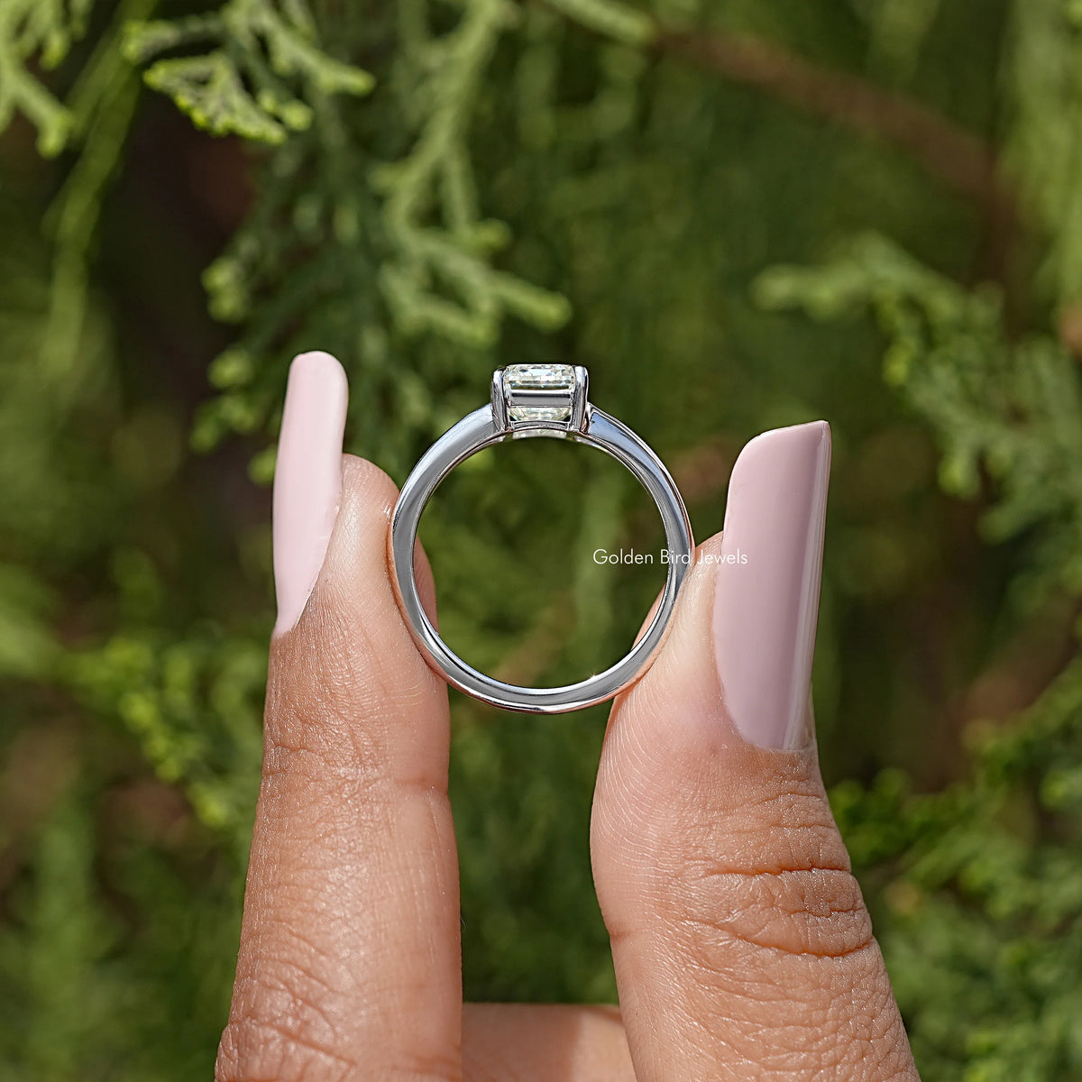 Sterling silver split-shank ring with emerald-cut stone, front view