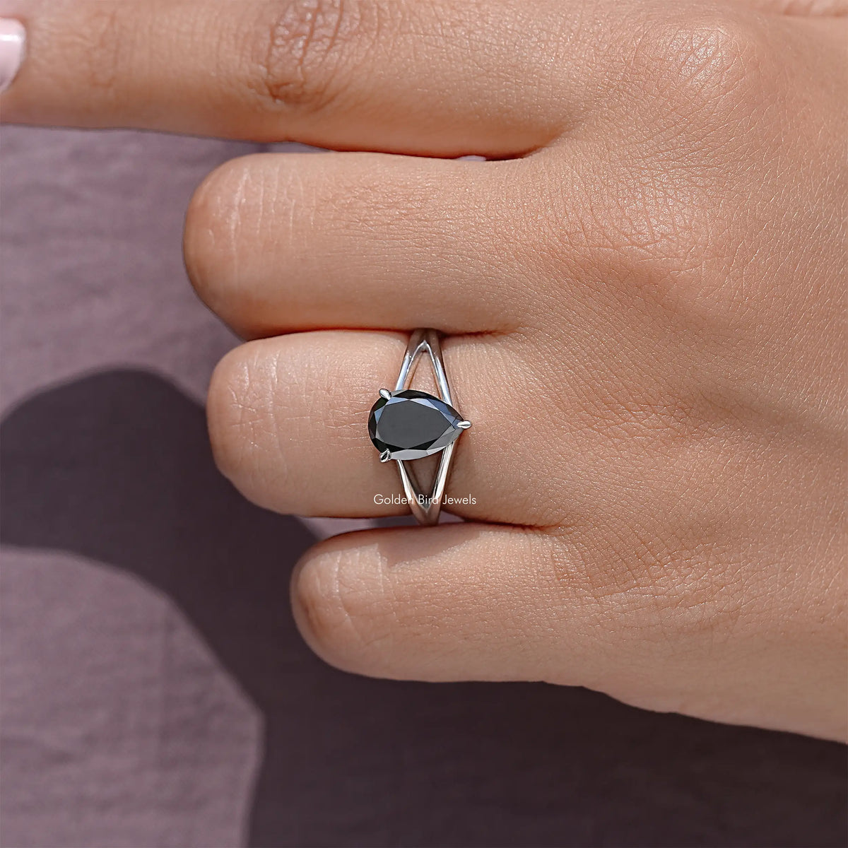 925 sterling silver ring with pear-cut black moissanite solitaire on slim split band