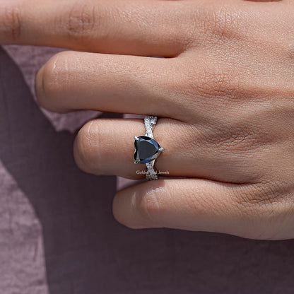 Black heart moissanite twisted accent ring in silver on a hand