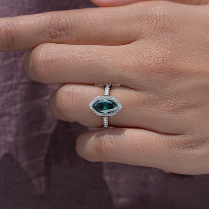 Sterling silver marquise halo accent ring on fingers, green marquise center stone