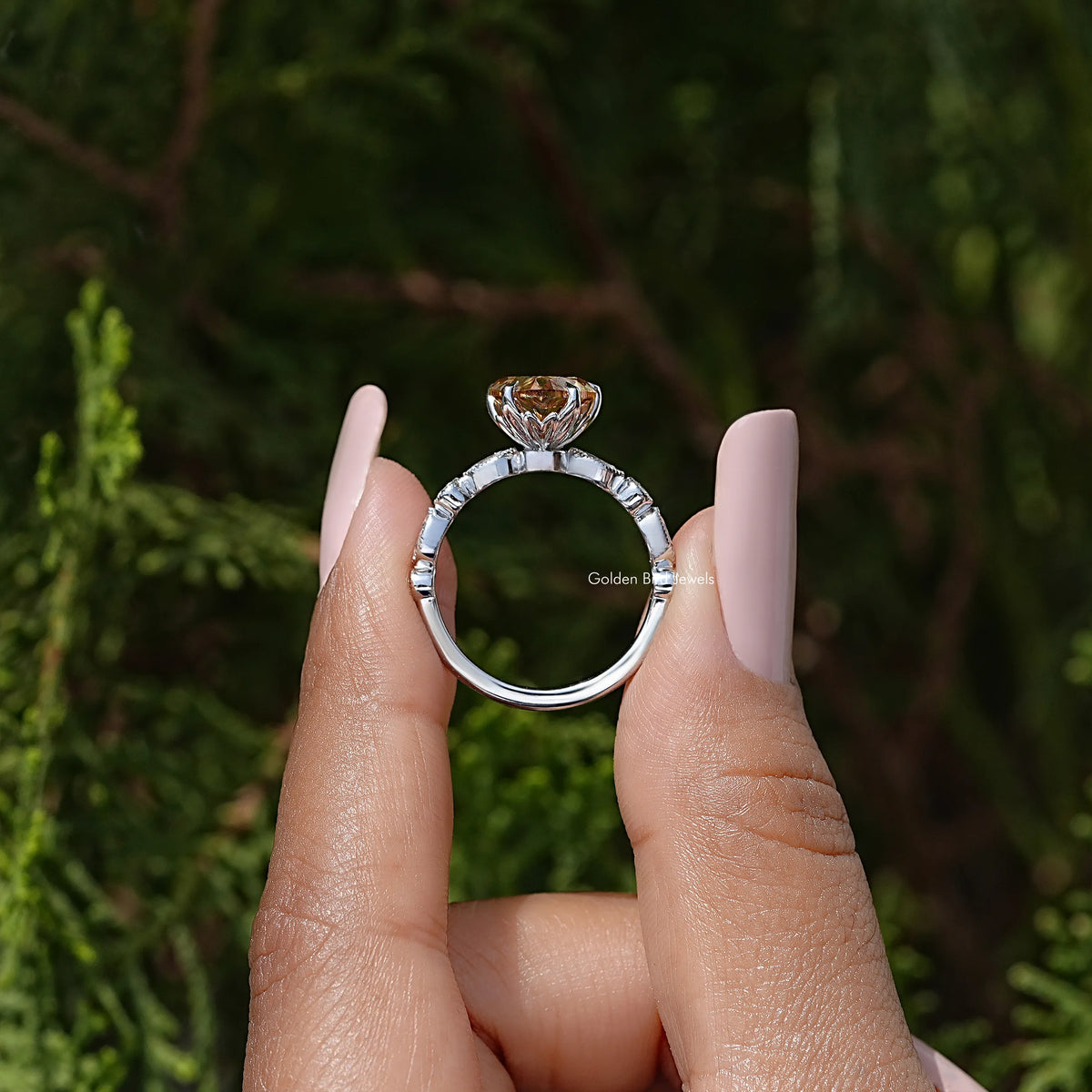 Open top view of heart-shaped moissanite ring showing sterling silver band and setting