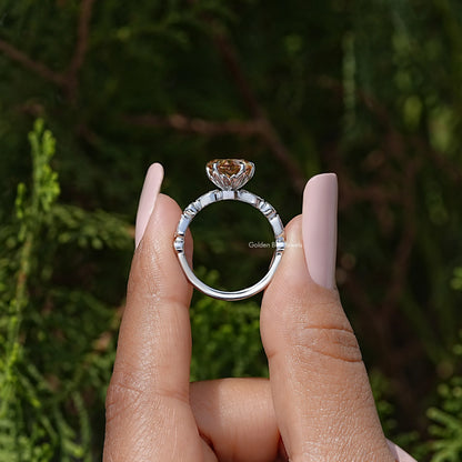 Open top view of heart-shaped moissanite ring showing sterling silver band and setting