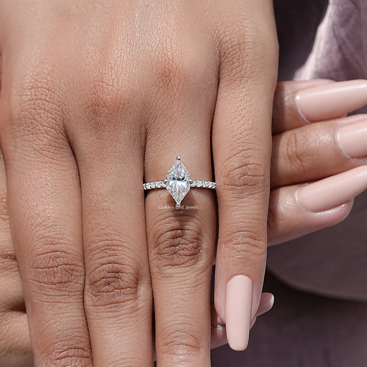 Marquise moissanite solitaire engagement ring with sterling silver band and prong setting