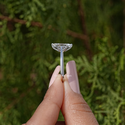 Sterling silver marquise moissanite solitaire ring with raised center stone, profile view