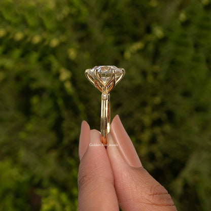 Moissanite solitaire engagement ring with tapered prong setting, rose-gold tone