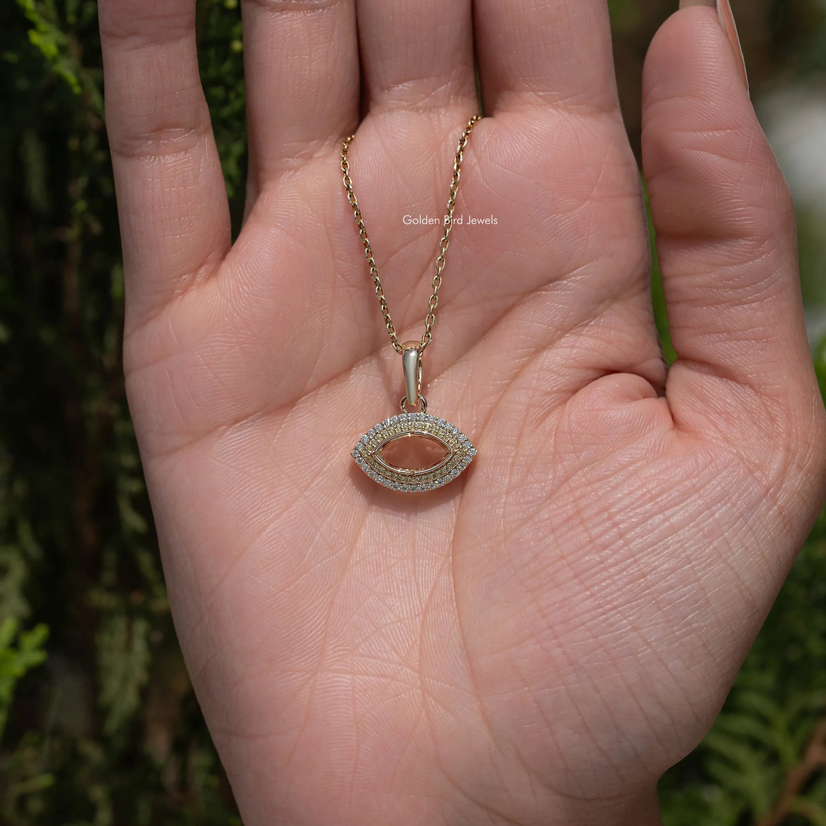 Marquise open pendant on a gold chain with pavé moissanite detail