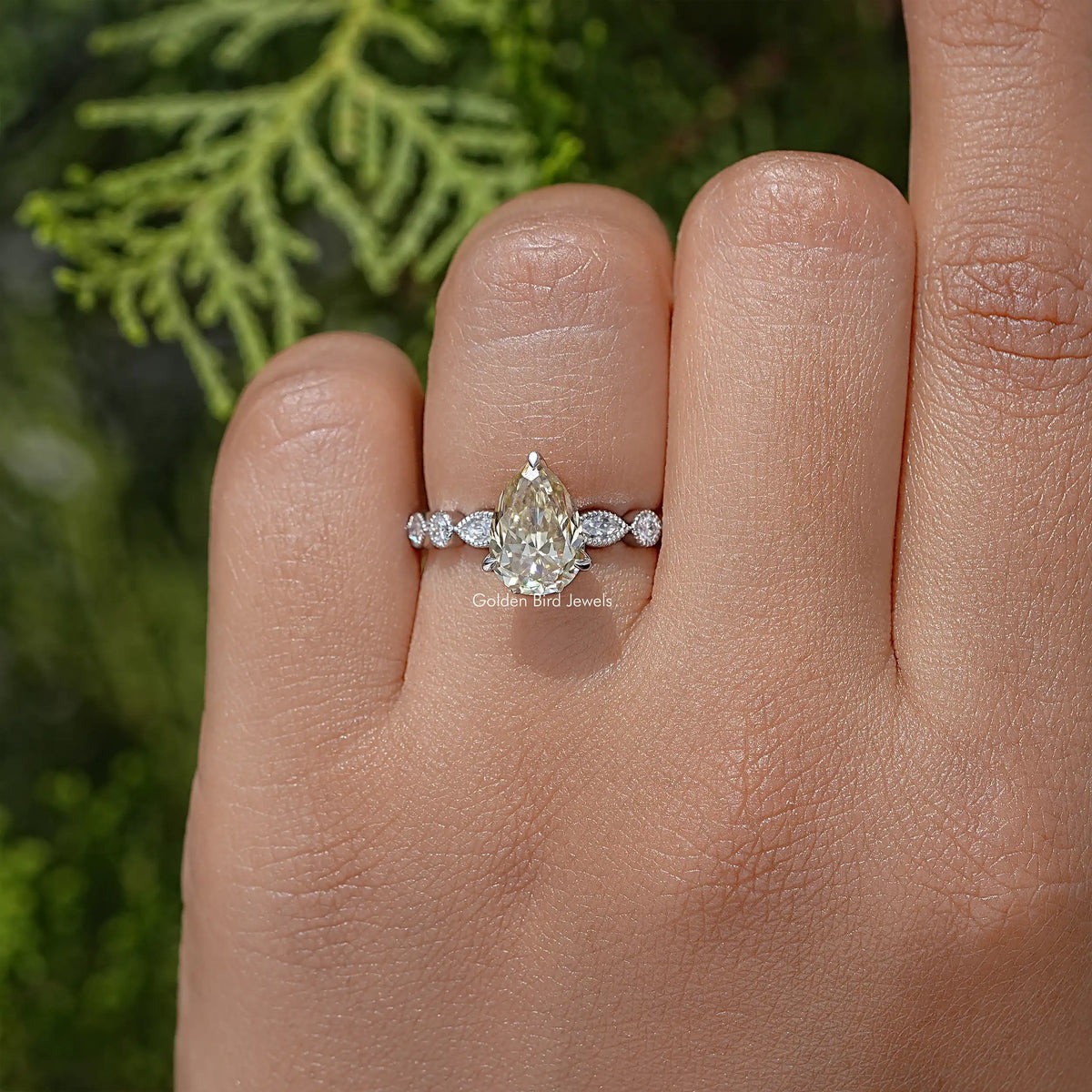 Pear-cut yellow moissanite engagement ring in sterling silver