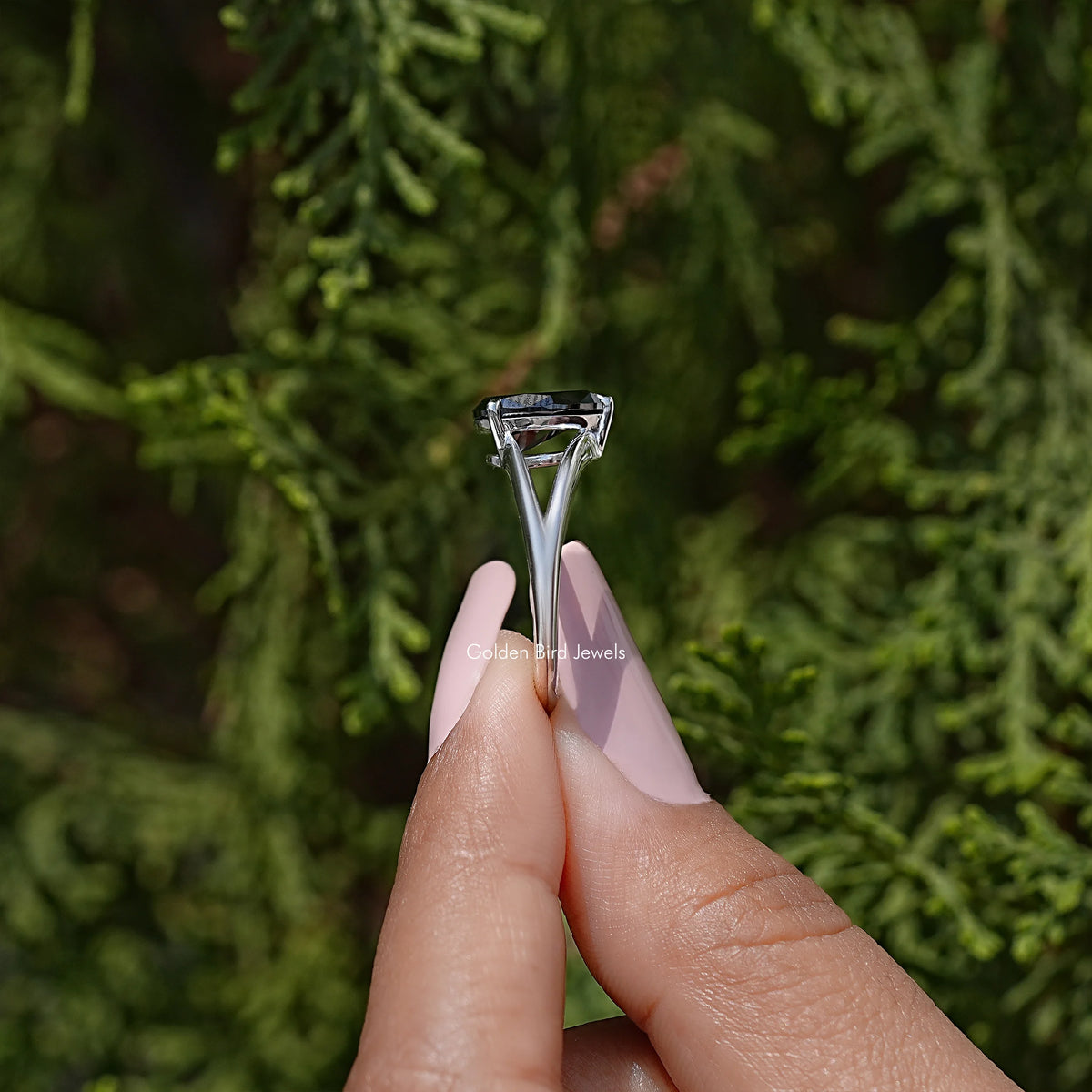 View of prongs on 925 sterling silver split-shank ring with black pear-cut moissanite
