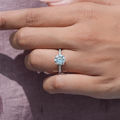 Round-cut moissanite solitaire on sterling silver band, front view