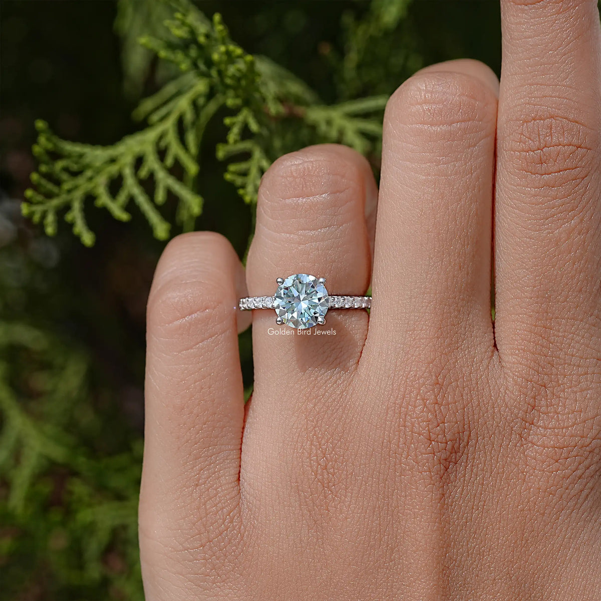 Sterling silver round moissanite solitaire ring with prong-set center