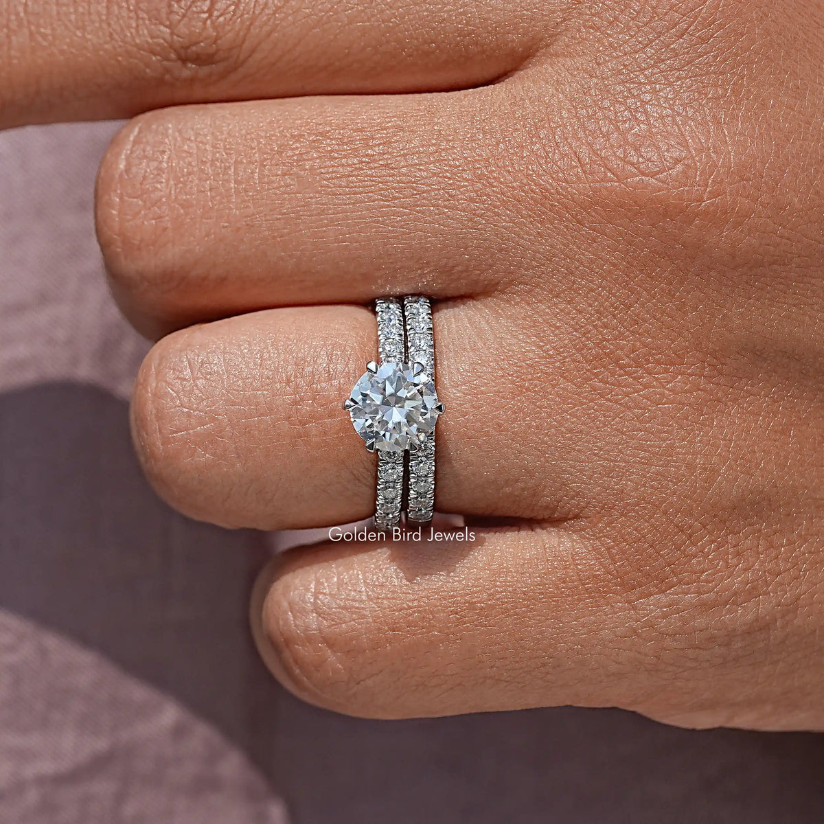 Round-cut moissanite engagement ring set with pavé band