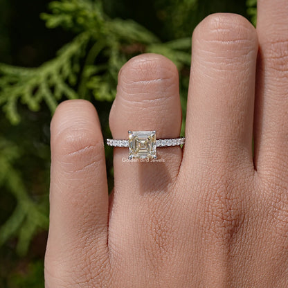 Sterling silver band ring with asscher-cut gemstone, worn on hand