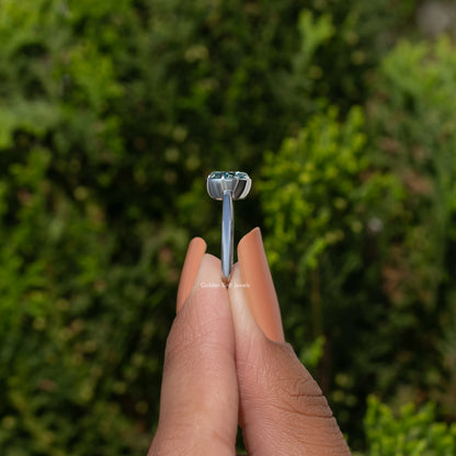 Oval blue moissanite solitaire ring in 925 sterling silver, side view