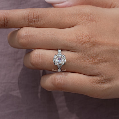 Vintage elongated cushion solitaire ring with halo on hand