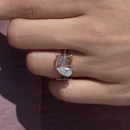 Toi et moi ring on finger, square warm brown and clear moissanite stones with halo accents