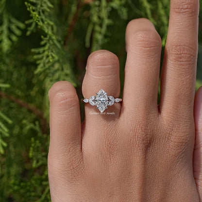 Marquise-cut moissanite diamond leaves ring on hand, marquise center with leaf accents