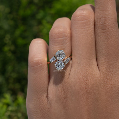 White metal bypass engagement ring with two cushion-cut diamonds and baguette side stones