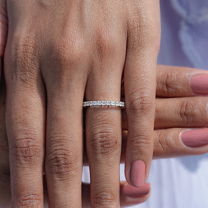 18K white gold full eternity wedding band with square-cut stones on hand
