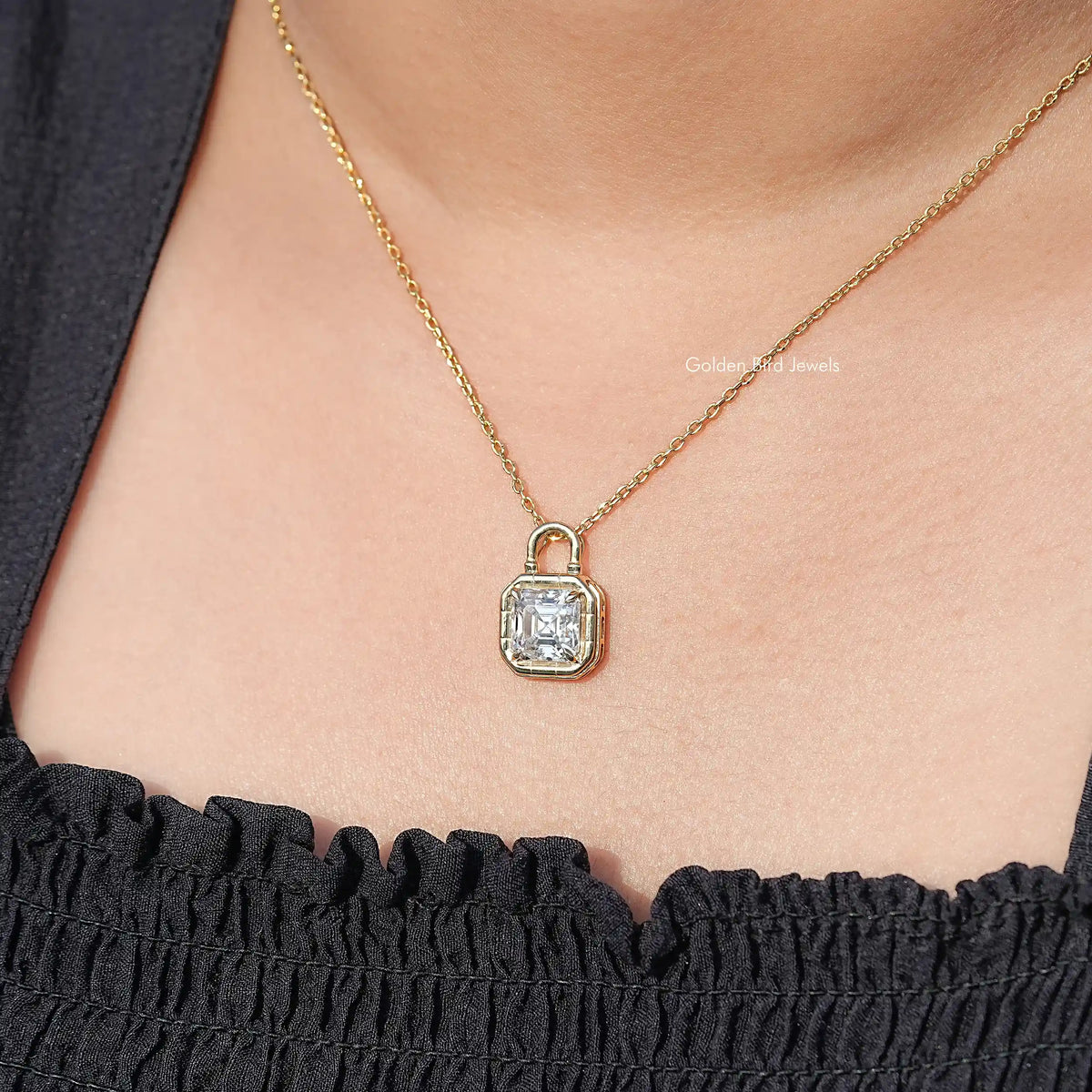 Asscher-cut square stone pendant with loop bail on a gold-tone chain