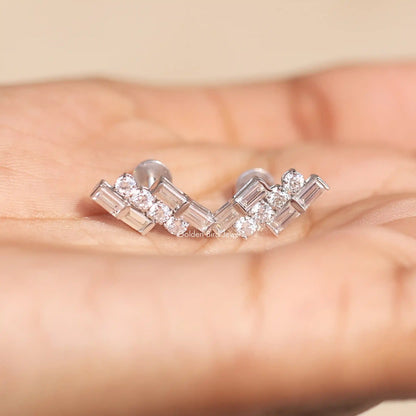 In Hand View Of baguette and round cut moissanite stud Earring