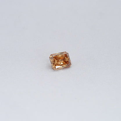 Champagne moissanite loose stone, small emerald-cut with facet sparkle