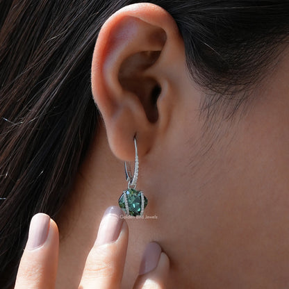 Sterling silver dangle earrings with emerald-green cushion-cut moissanite drop, side view