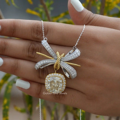 In hand showing view of moissanite pendant	 	