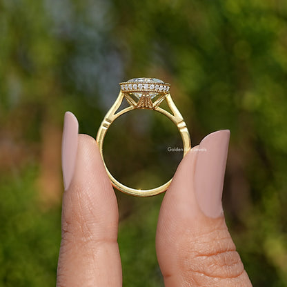 Bezel-set cushion-cut solitaire ring in yellow metal, side view