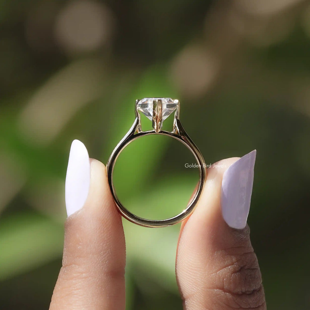 Silver-toned solitaire ring with marquise-cut moissanite center stone