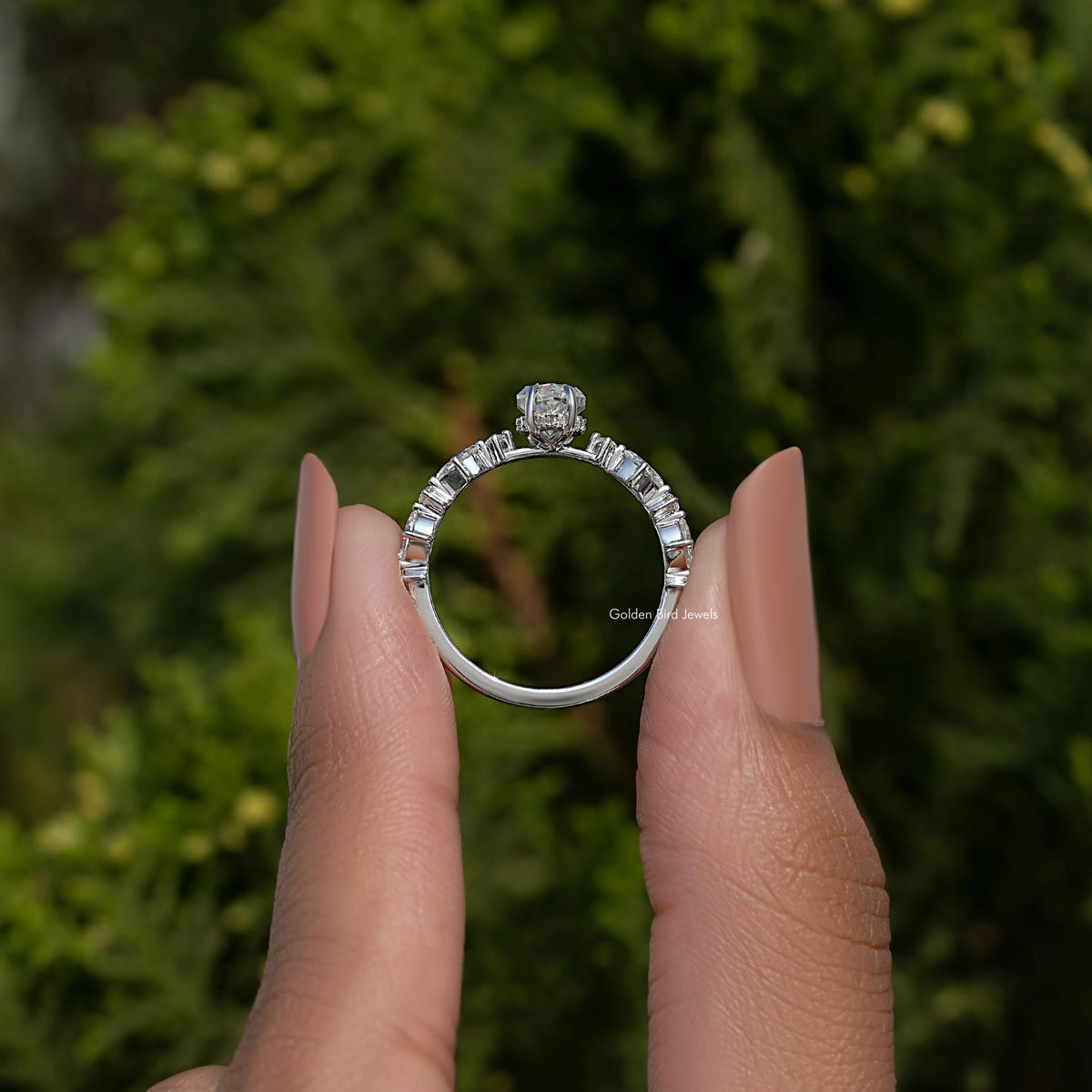 Sterling silver marquise moissanite ring with a central elongated stone and side accents