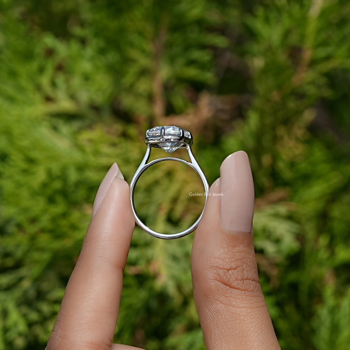 Back View of Elongated Cushion Cut Moissanite Ring In two fingers
